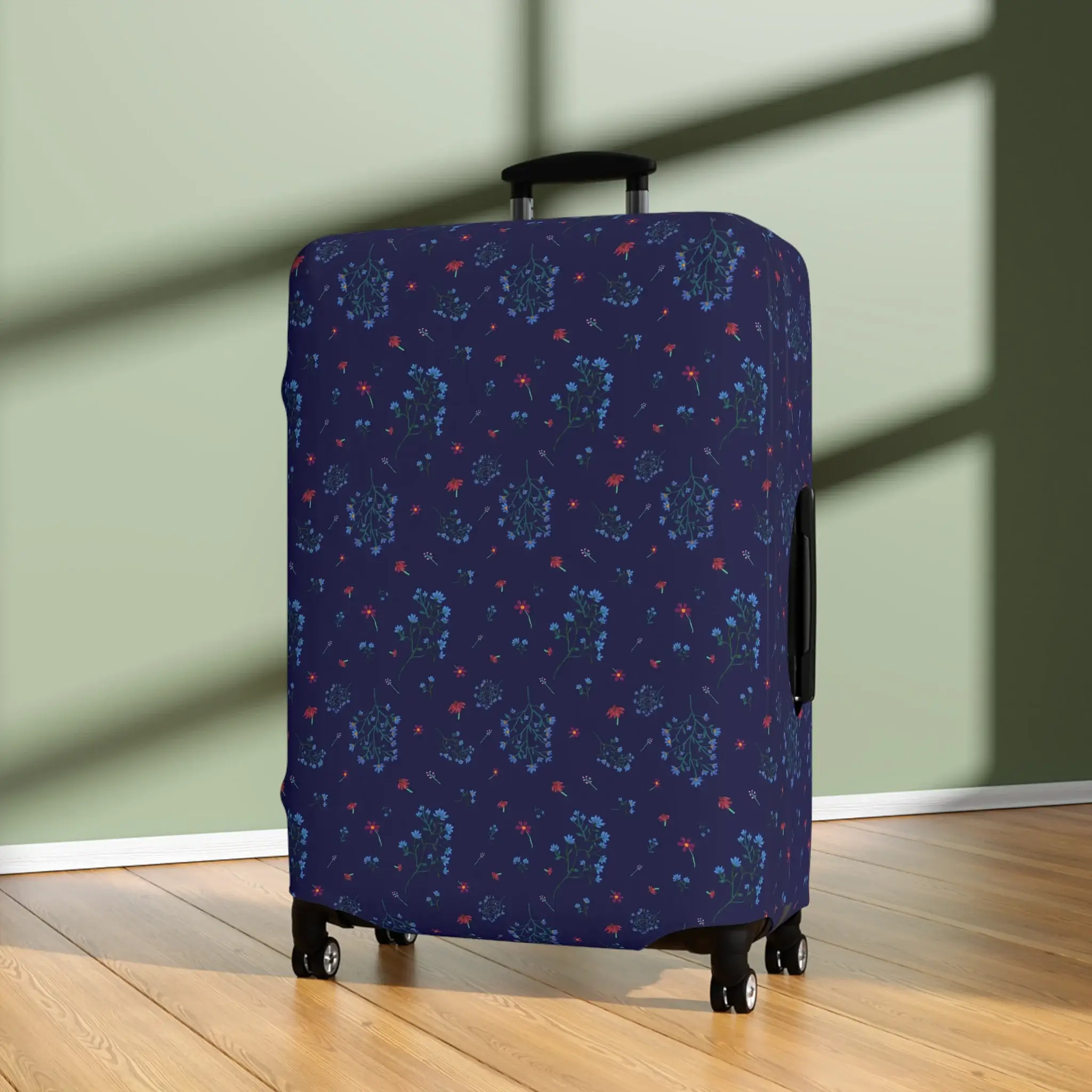 Close-up of a 28" x 20" navy blue floral luggage cover from the Woodland Bloom collection, snugly fitted on a suitcase.