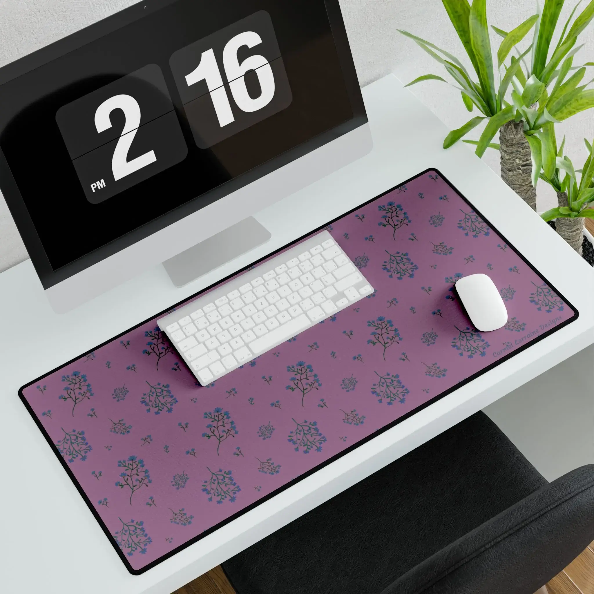 Large floral desk mat with plum-toned background and soft navy and tan wildflowers. Smooth, non-slip design.