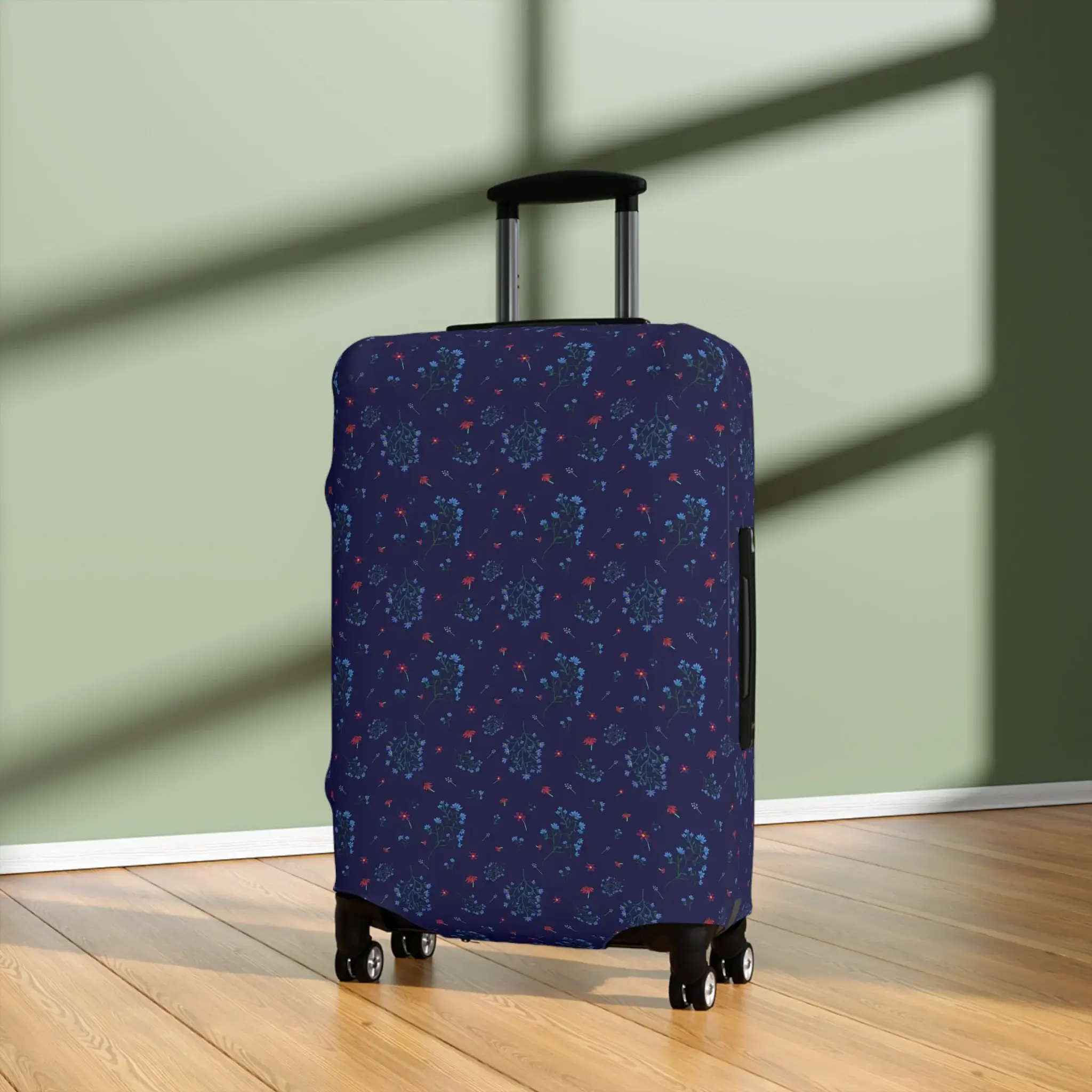 Close-up of a 25" x 16" navy blue floral luggage cover from the Woodland Bloom collection, snugly fitted on a suitcase.