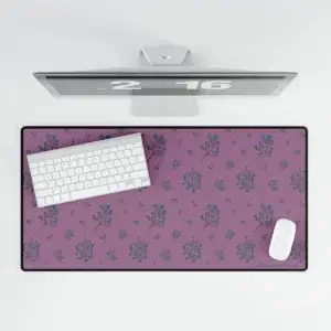 Large floral desk mat with plum-toned background and soft navy and tan wildflowers. Smooth, non-slip design.