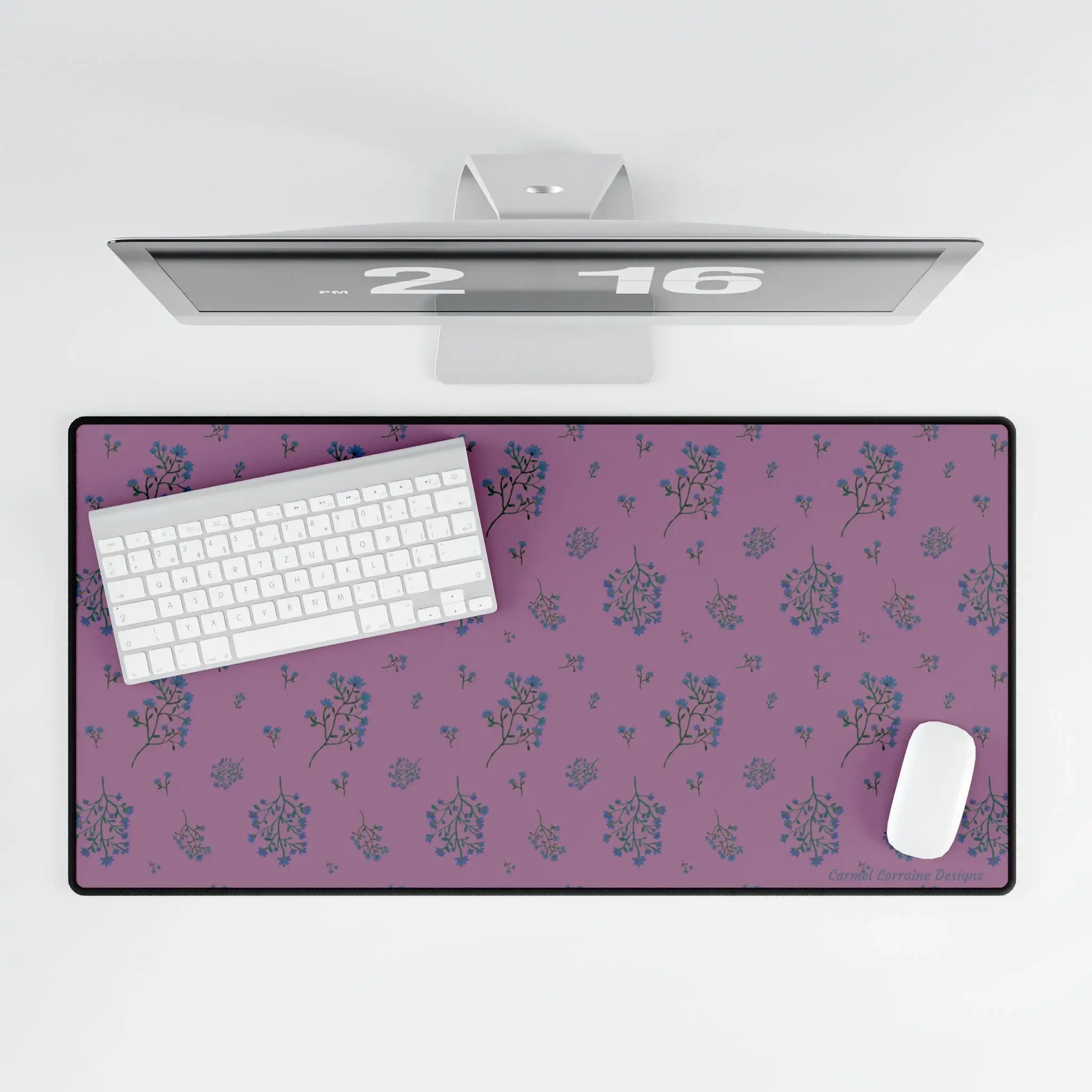 Large floral desk mat with plum-toned background and soft navy and tan wildflowers. Smooth, non-slip design.