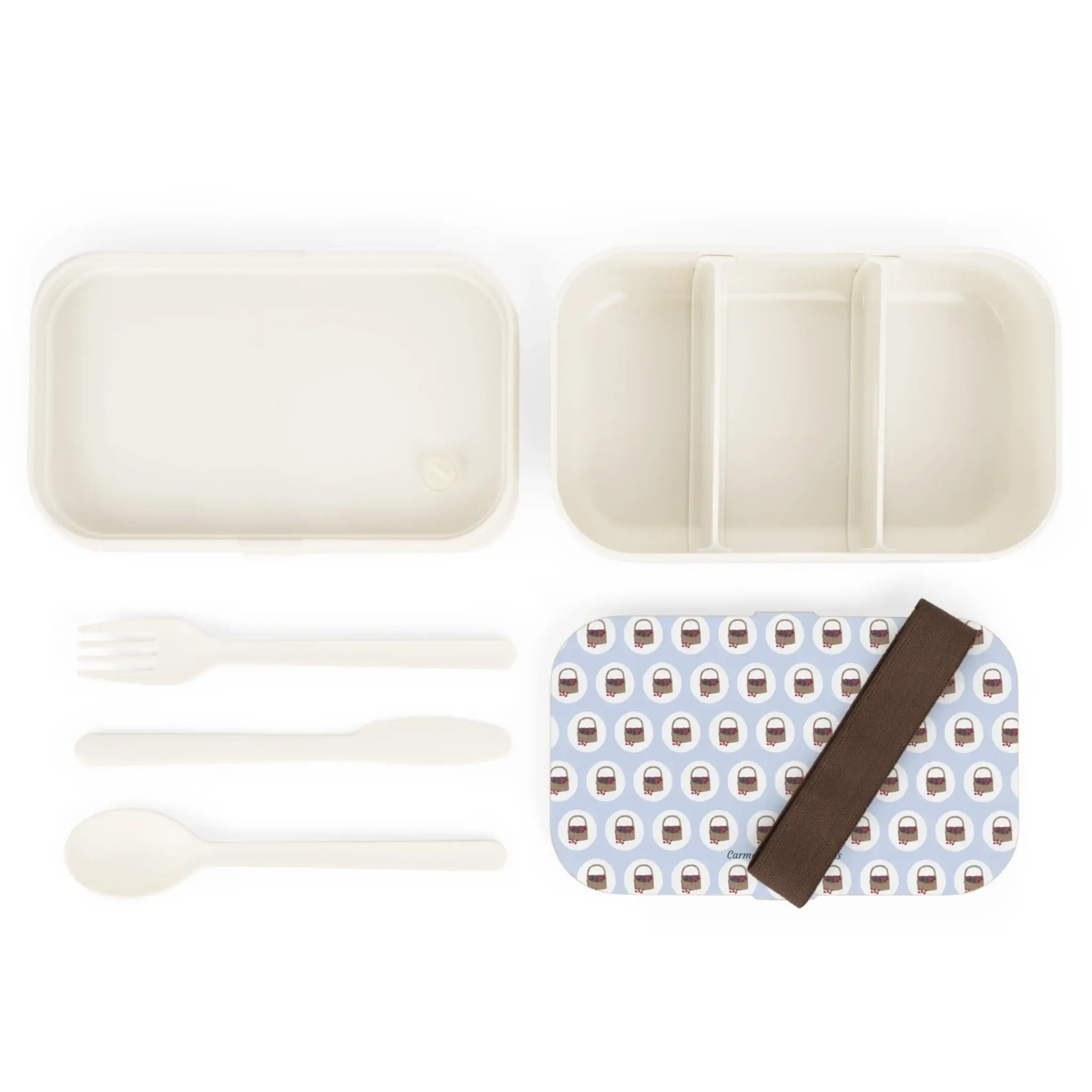 Basket of Berries bento lunchbox with berry pattern on light blue background and wooden lid.