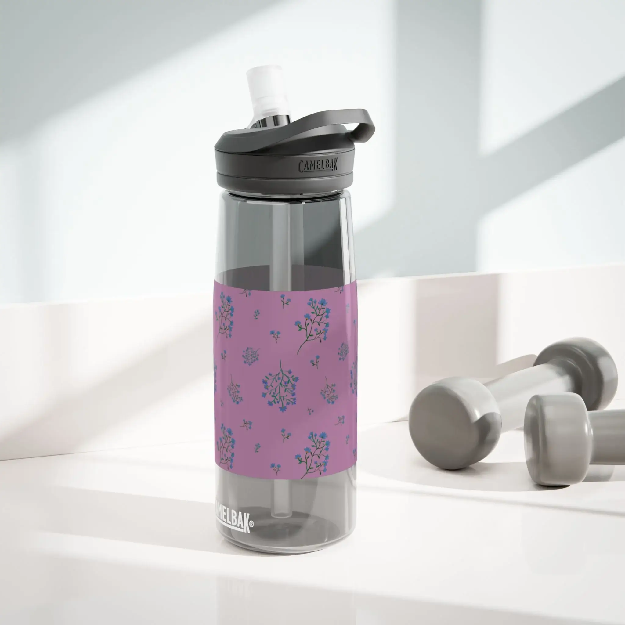 CamelBak water bottle with Woodland Lavender Breeze floral wrap in plum and navy, on a clear grey 25oz bottle.
