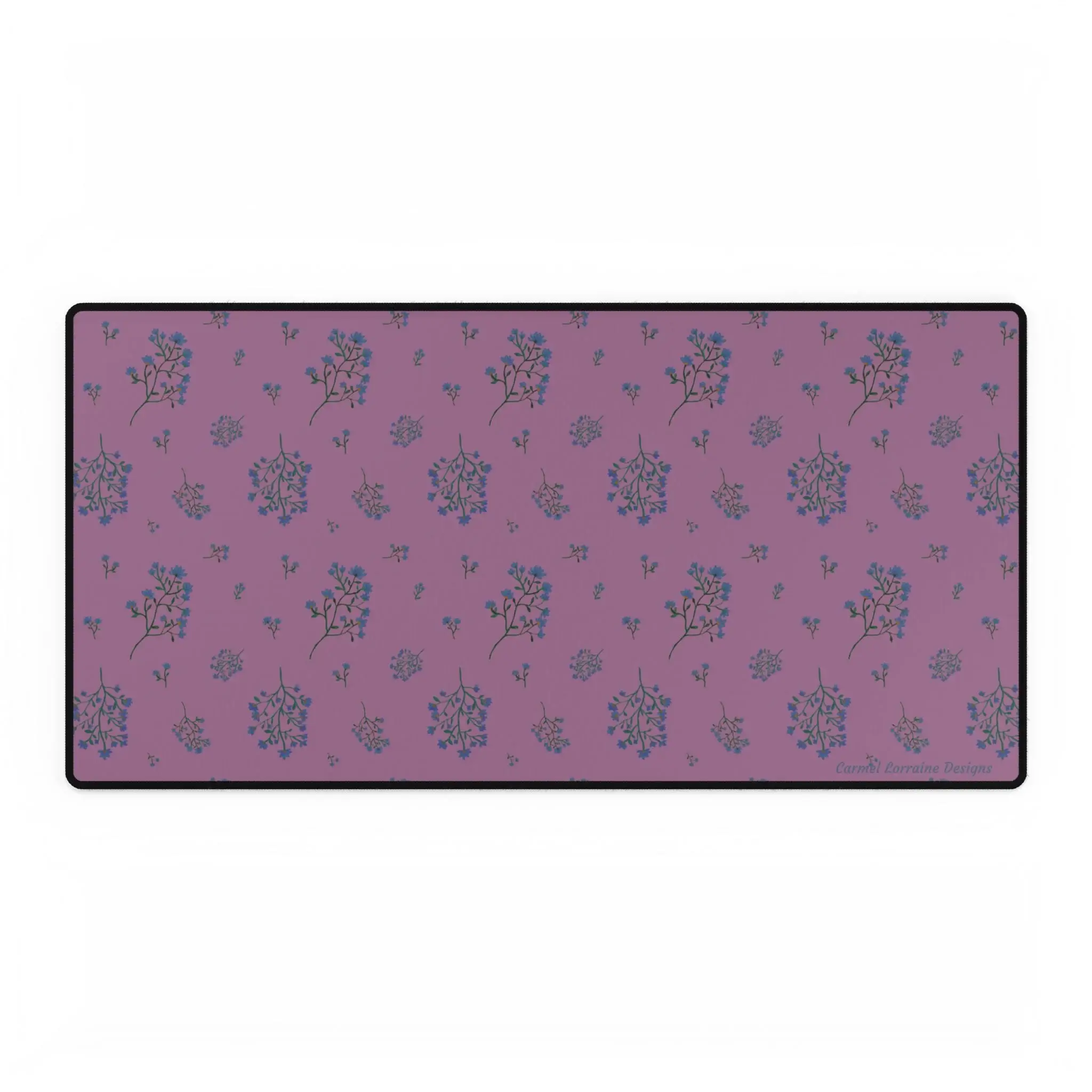 Large floral desk mat with plum-toned background and soft navy and tan wildflowers. Smooth, non-slip design.