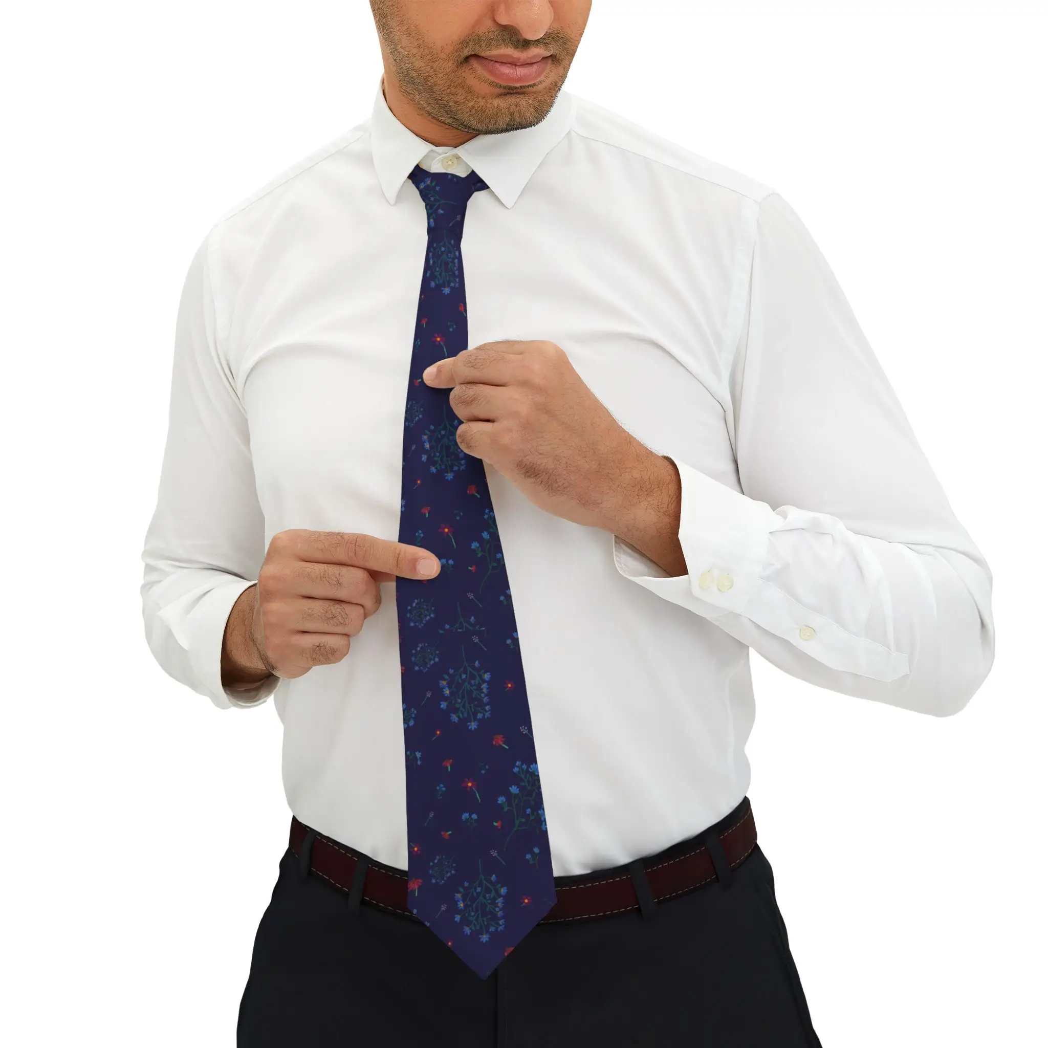 Woodland Bloom necktie featuring a deep navy floral pattern with lilac, saffron, magenta, and periwinkle flowers. Made from smooth polyester with a silky finish and tan keeper loop.