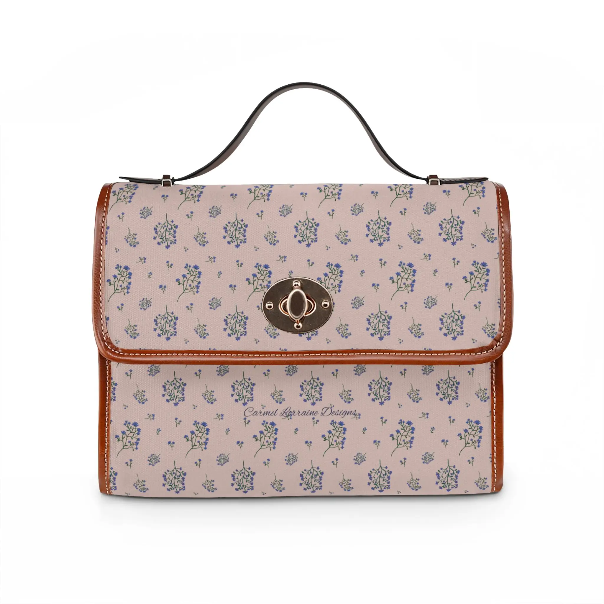 Lavender Breeze crossbody handbag featuring a soft lilac floral pattern with periwinkle blue, saffron, magenta, and berry-toned flowers. Medium-sized waterproof canvas bag with tan PU leather handles and an adjustable shoulder strap.